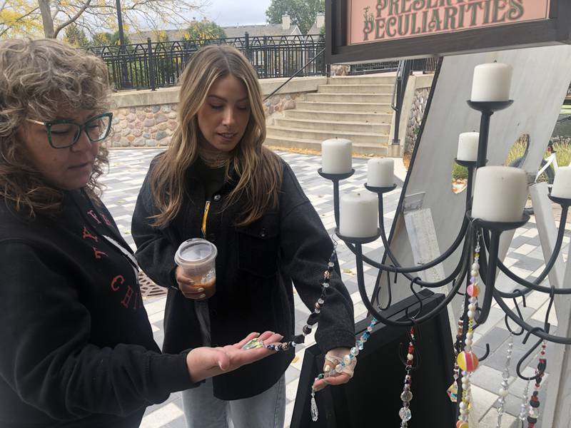 Lori Fisher, left, and Shelby Fairweather, right, have stores next door to each other at the McHenry Riverwalk Shoppes. They are hosting a Samhain observance at their stores on Friday, Nov. 1, 2024.