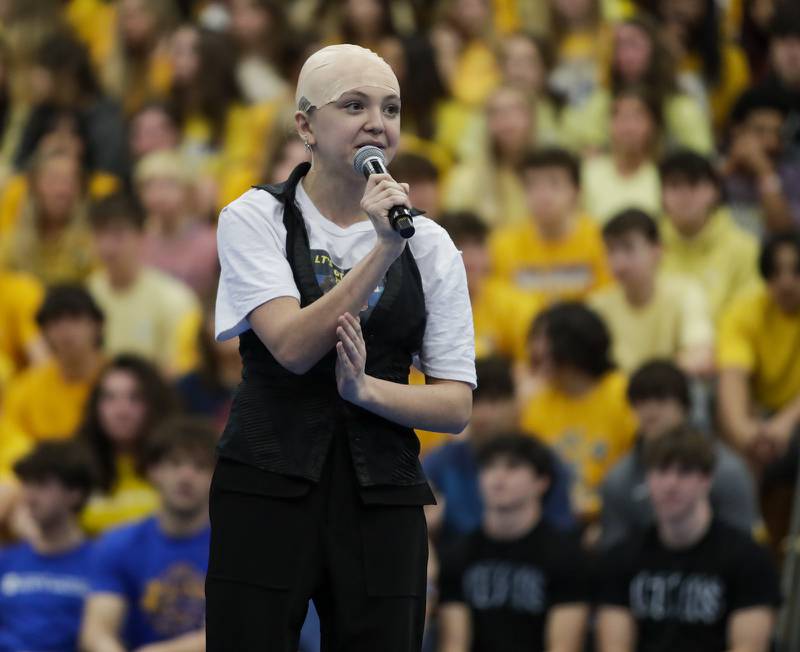 Lyons Township senior Maia Halm of Western Springs emcee’s the all-school assembly in La Grange on Friday, April. 22, 2022.