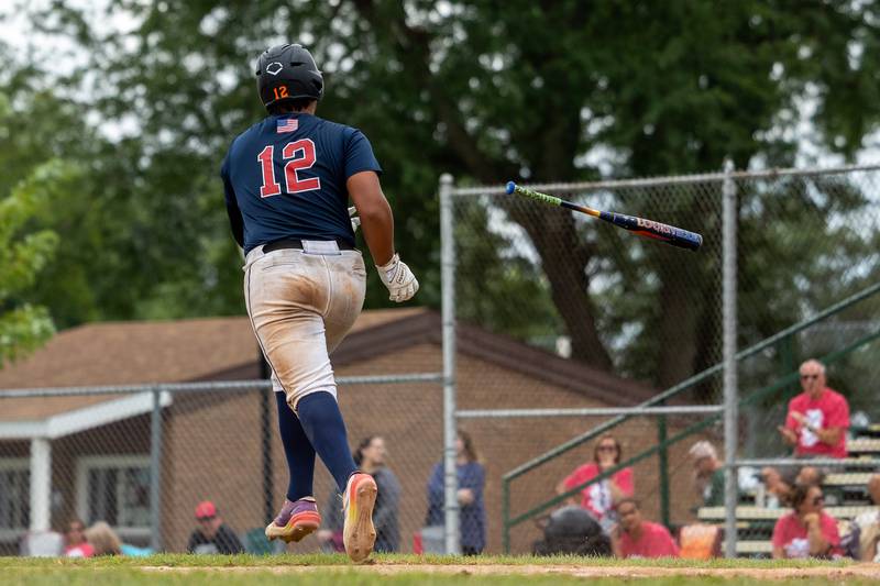 Edgar Villanueva (12) of Illinois throws bat after being walked on Thursday, July 17, 2025 at Washington Park in Peru.