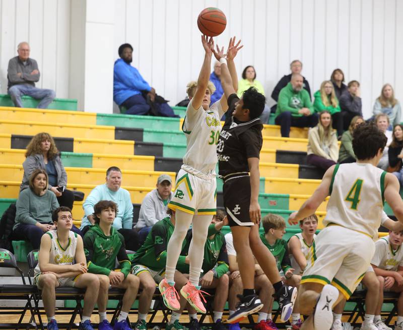 Providence’s Seth Cheney puts up the three point shot against Joliet Catholic on Saturday, Dec. 9th, 2023 in New Lenox.