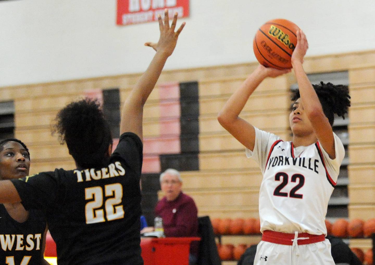 Yorkville's Alex Stewart (22) fires a three-point shot over Joliet West defender Makayla Chism during a girls' basketball game at Yorkville on Thursday, Jan. 19, 2023.