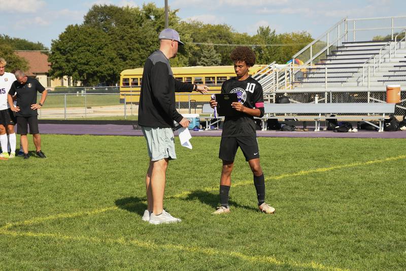 Manteno's Justin Foster receives his award after the Rivals Cup Championship game on Saturday, Sept. 27, 2025.