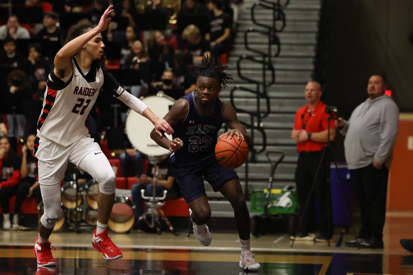 Oswego East’s Micah Gatewood drives along the baseline against Bolingbrook.