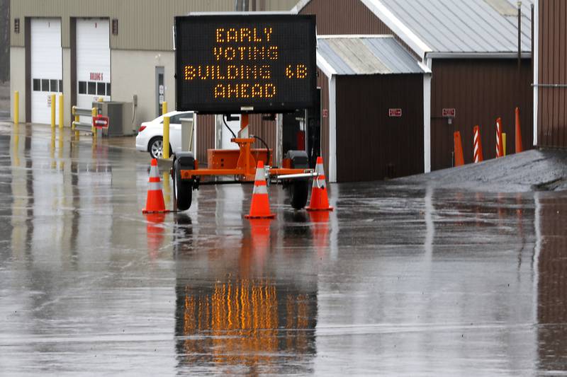 A sign directs voters to the early voting site at the Algonquin Township office in Cary on Friday, March 8, 2024.