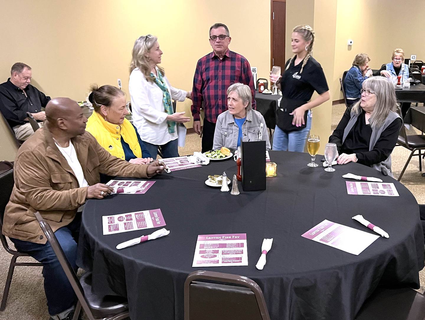 A table of regulars to the fish fry chat before dinner Friday, March 20, 2026, during the annual Lenten season fish fry at Faranda’s Banquets in DeKalb. The fish fries are 4 to 8 p.m. Fridays through April 3 at the banquet center and a portion of the procedes go to support multiple social service agencies in DeKalb County.