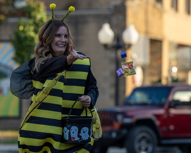 Parader tosses candy to children at the annual Princeton Halloween Parade on Saturday, Oct. 4, 2025 on Main Street in Princeton.