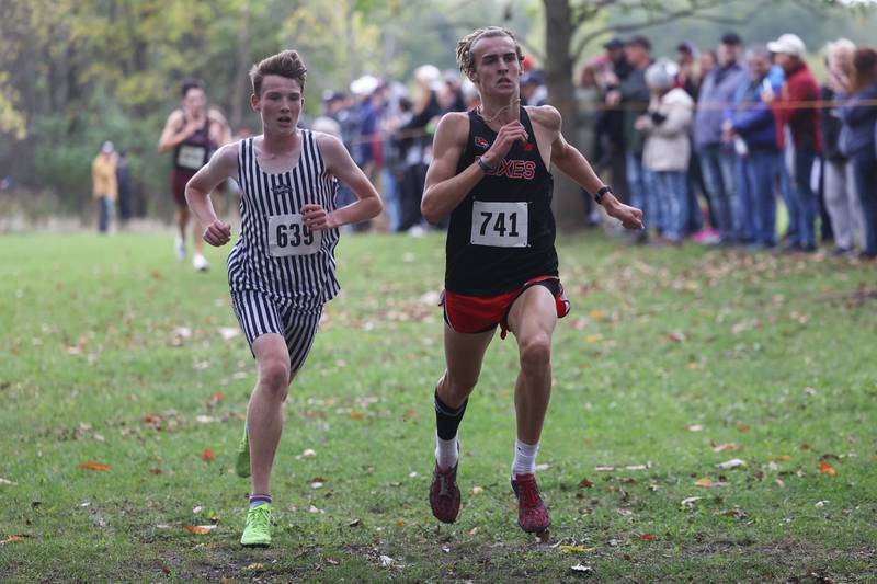 Yorkville’s Owen Horeni beats out Plainfield South’s Riley Fink fork sixth in the Southwest Prairie Conference meet at Channahon Park in Channahon on Friday, Oct. 13, 2023.