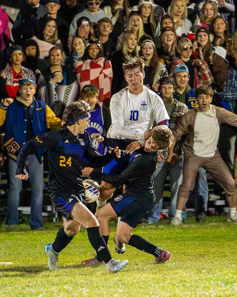 Austin Roop (10) of Hinckley-Big Rock collides with Lane Rohrer (10) of Somonauk/Leland/Newark in pursuit of ball during the Little Ten Conference Championship match on Thursday, Oct. 9, 2025 at Hinckley-Big Rock School in Hinckley.