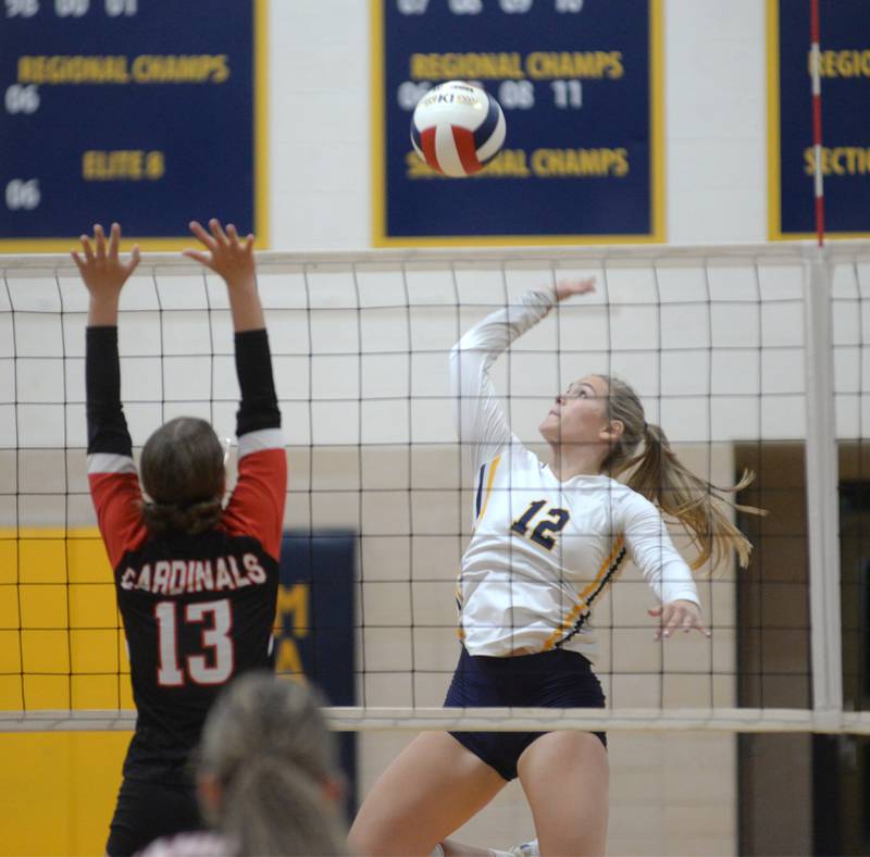 Polo's Katelyn Rockwood (12) spikes as Forreston's Hannah Vinnedge (13) blocks during a Wednesday, Aug. 28, 2024 match at Polo High School.
