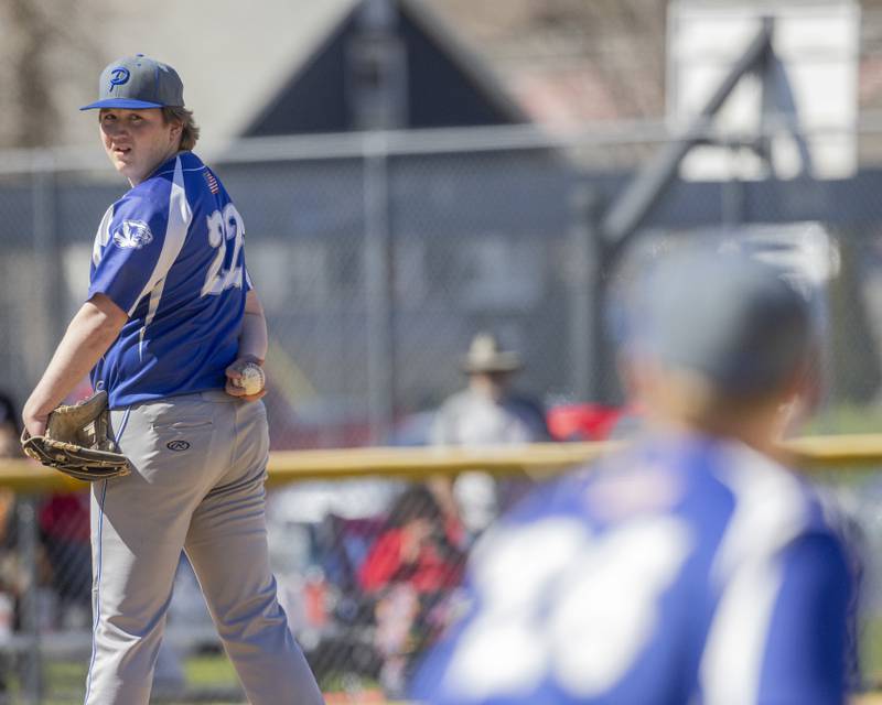 Pitcher Jordan Reinhardt glances over to check the Hall Baserunner on first base during the game at Foley Field on April 6, 2024.