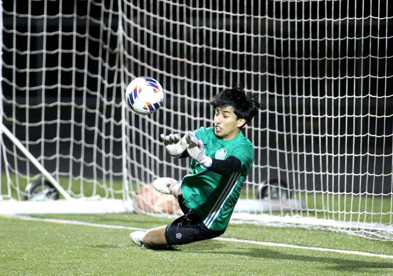 York goalkeeper Diego Ochoa makes a save in the penalty kick round of the 3A Boys Soccer Supersectional against Elgin at Streamwood High School on Tuesday, Nov. 1, 2022.