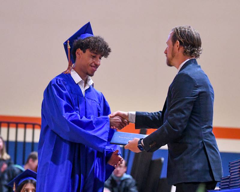 Genoa-Kingston senior Terrell De Angelo Marshall is all smiles as he receives his diploma during his graduation ceremony Saturday, May 18, 2024, at Genoa-Kingston High School, 980 Park Ave., Genoa.