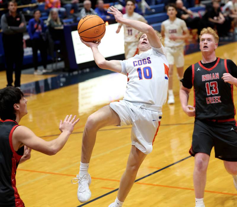 Genoa-Kingston's Trevor Rhoads takes an off-balance shot in front of Indian Creek's Isaac Willis during their game Friday, Jan. 2, 2026, at Genoa Kingston High School.