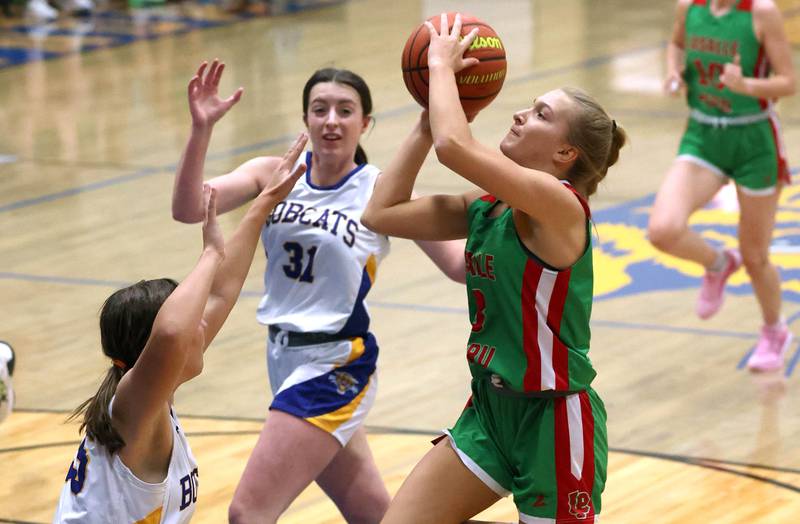 LaSalle-Peru's Kaylee Abens gets up a shot between two Somonauk players during their game Thursday, Nov. 16, 2023, in the Tim Humes Breakout girls basketball tournament at Somonauk High School.