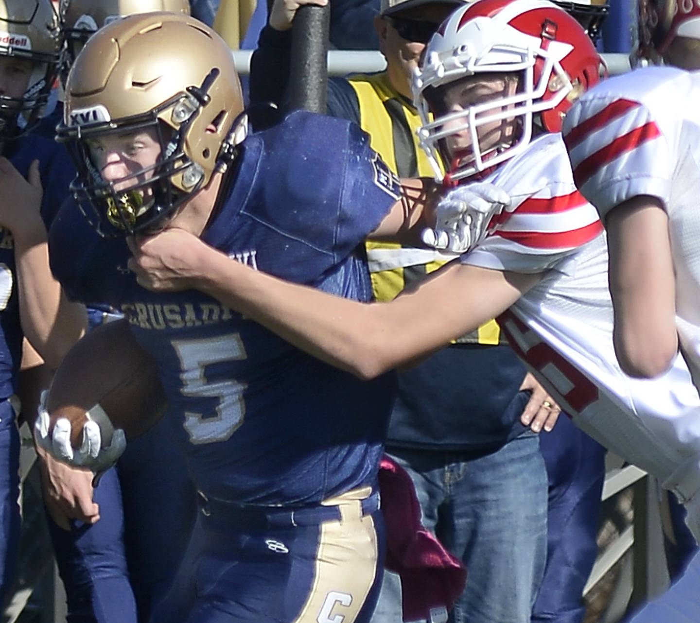 Marquette’s Tom Durdan is held back by Colton Bielema on a run in the 1st quarter during the Class 1A first round playoff game on Saturday, Oct. 29, 2022 at Gould Stadium in Ottawa.