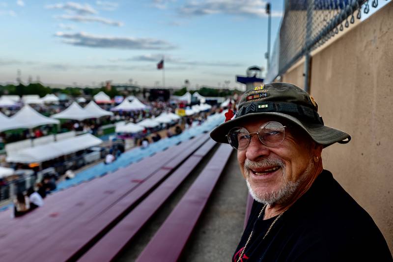 Lifelong Joliet resident James Giacomi sits at the top of the bleachers, as he does every year, during Taste of Joliet on June 20, 2025.