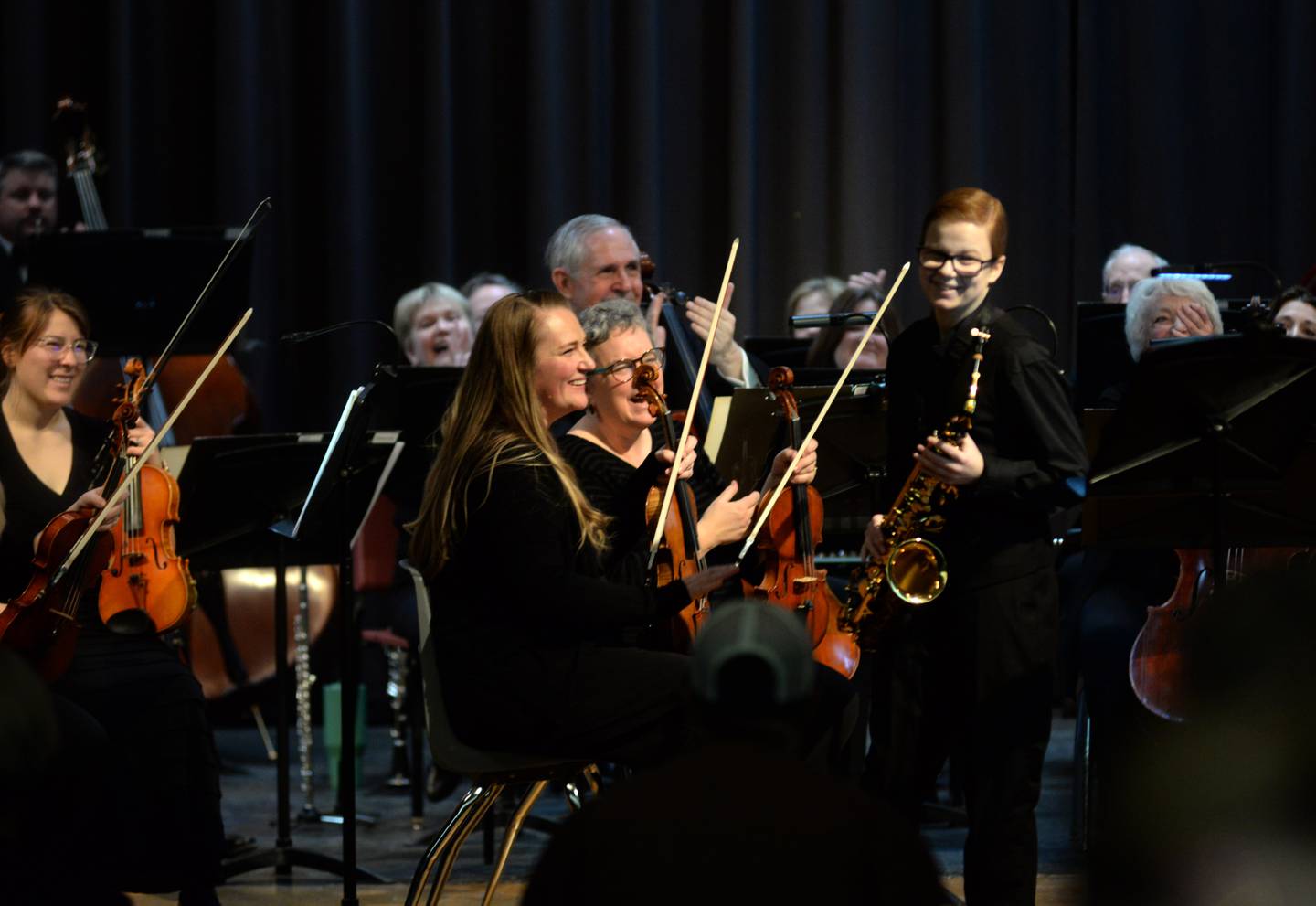 Rileigh Wren smiles after playing the saxophone with the Clinton Symphony Orchestra during the Family Concert on Sunday, Feb. 23, 2025 in the Morrison High School Auditorium.