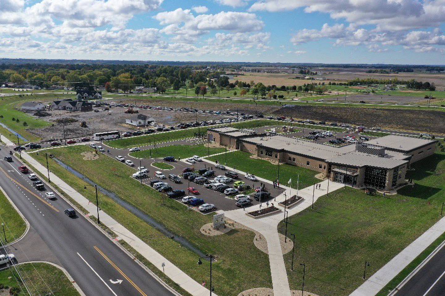 An aerial view of vehicles gathered Tuesday, Oct. 26, 2021, at the Peru Police Department as they set off for a march in La Salle-Peru, seeking answers in the Jelani Day death investigation.