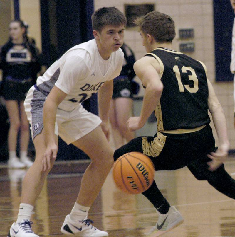 Sycamore player Xander Lewis brings the ball up court against  Dixon's Cameron Folker . The Dixon Dukes hosted  the Sycamore Spartans in a non-conference game  on Friday, December 19th, 2025.