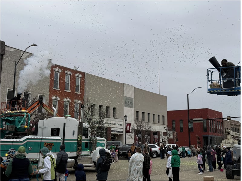 Green and gold confetti rains down on spectators of the La Salle St. Patrick's Parade.