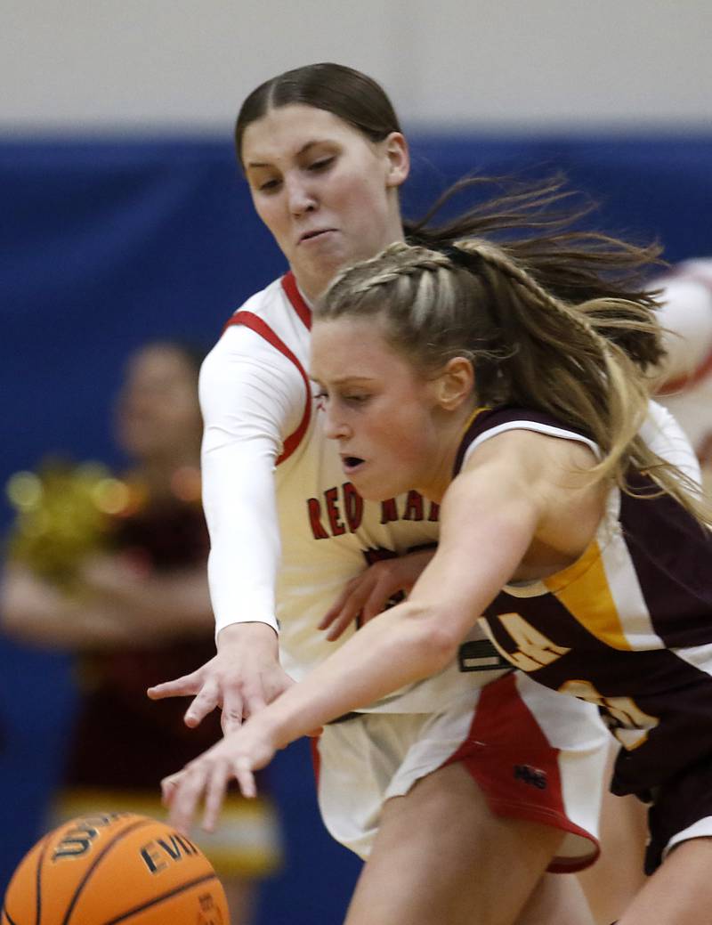 Huntley's Evie Freundt tries to steal the ball from Loyola Academy's Clare Weasler during the IHSA Class 4A Gurnee Warren Supersectional girls basketball game on Monday, March 3, 2025, at Warren Township High School in Gurnee.