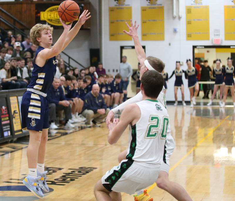 Marquette's Griffin Walker shoots a jump shot over Seneca's Paxton Giertz and teammate Calvin Maierhofer during the Tri-County Conference championship game on Friday, Jan. 27, 2023 at Putnam County High School.
