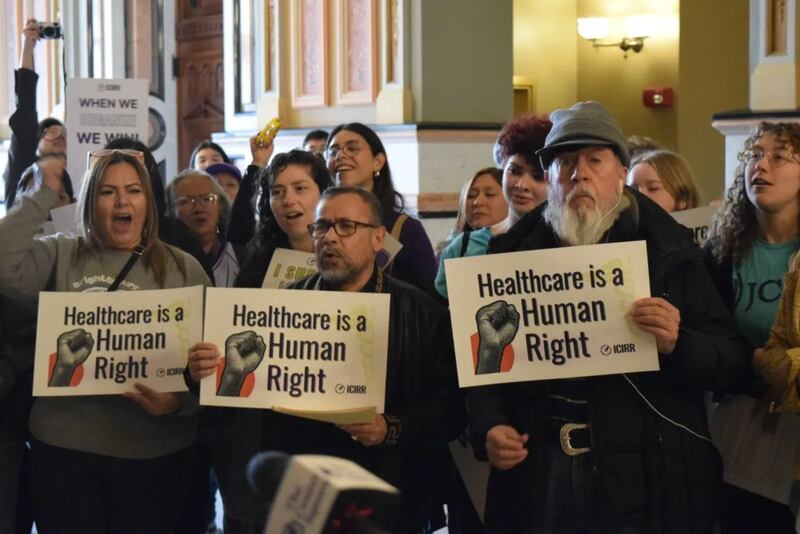 A crowd of about 100 people gathered at the Illinois Capitol on Wednesday for a rally urging state lawmakers to continue pro-immigrant policies