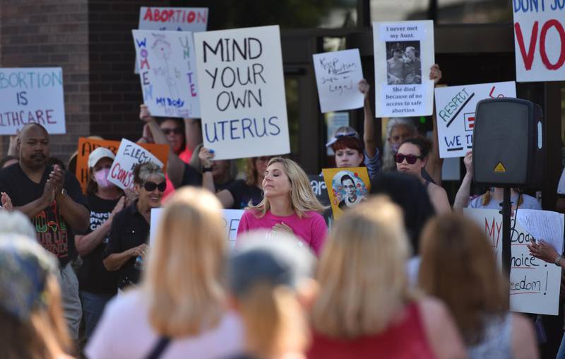State Rep. Terra Costa Howard, a Glen Ellyn Democrat, closes her eyes as the crowd applauds her comments at a rally in Wheaton in support of women’s fundamental right to privacy and bodily autonomy on Friday, June 24, 2022.