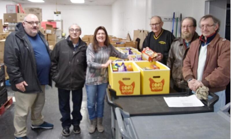 Oglesby Elks Lodge 2360 Exalted Ruler Sam Sankovich, members Bob Weiss, Ken Ficek, Gary Ferrari and Tim Watkins check out the boxes of food destined for families with Illinois Valley Food Pantry Executive Director Mary Jo Credi. The Oglesby Lodge donated $4,000 to the food pantry to help ease the burden of providing needy food for more than 650 families in the Illinois Valley. The donation was made possible using an Elks National Foundation Grant.