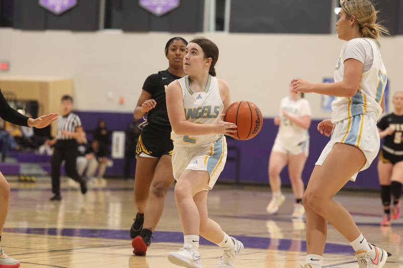 Joliet Catholic’s Molly Ryan goes in for the basket against Joliet West in the 2023 WJOL Girls Basketball Tournament on Friday, Nov. 17, 2023, in Joliet