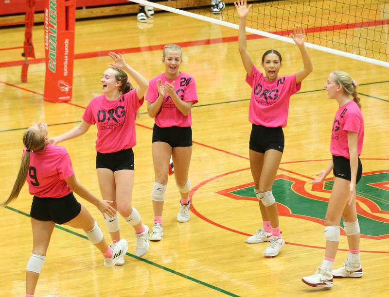 Members of the L-P volleyball team celebrate after defeating St. Bede during the "Cavs 4 A Cause" pink night game on Tuesday, Sept. 26, 2023 at Sellett Gymnasium.
