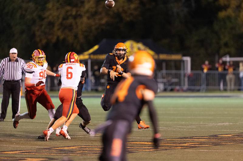 Wheaton Warrenville South's Justin Miller throws a pass against Batavia on Friday, Oct. 24,2025 in Wheaton.