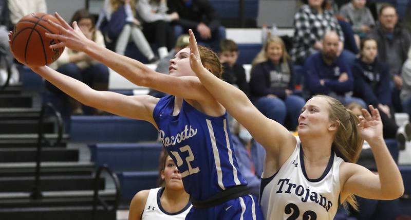 Burlington Central's Paige Greenhagel grabs a rebound in front of Cary-Grove's Maggie Groos during a Fox Valley Conference girls basketball game Friday Jan. 6, 2023, at Cary-Grove High School in Cary.