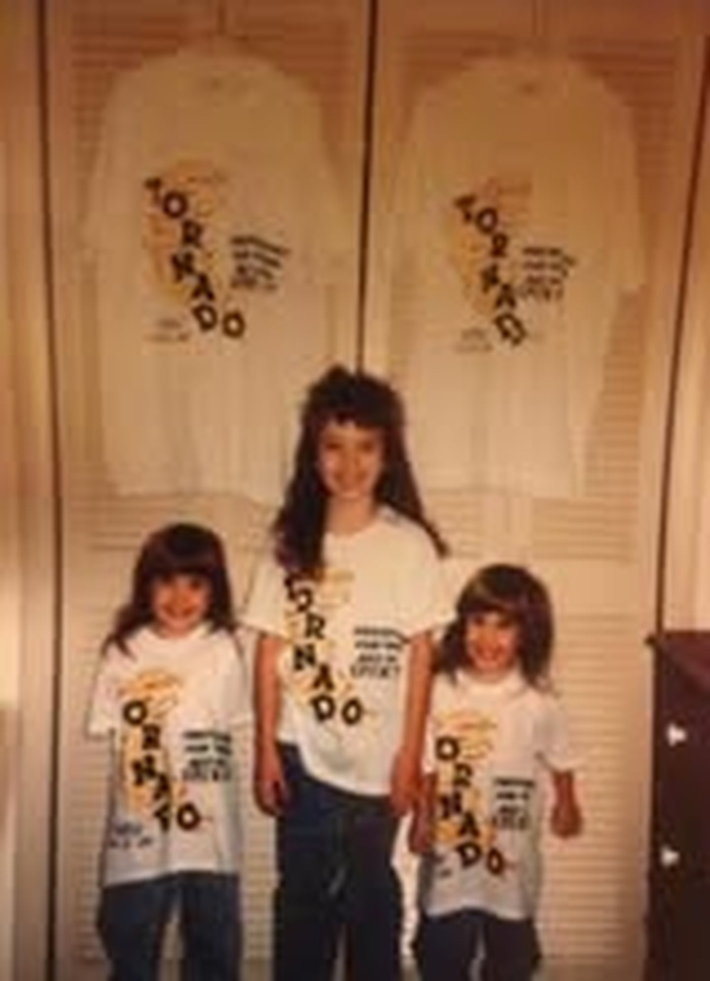 Kristen Merriman, a special education teacher at Central Elementary School in Plainfield, poses with her twin 4-year-old sisters around the time of the 1990 Will County tornado.