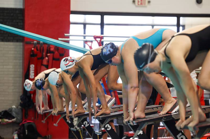 Swimmers from Bradley-Bourbonnais, Kankakee and Bishop McNamara ready for the 100-yard freestyle during Bradley-Bourbonnais' victory in the All-City swim meet on Tuesday, Sept. 9, 2025.