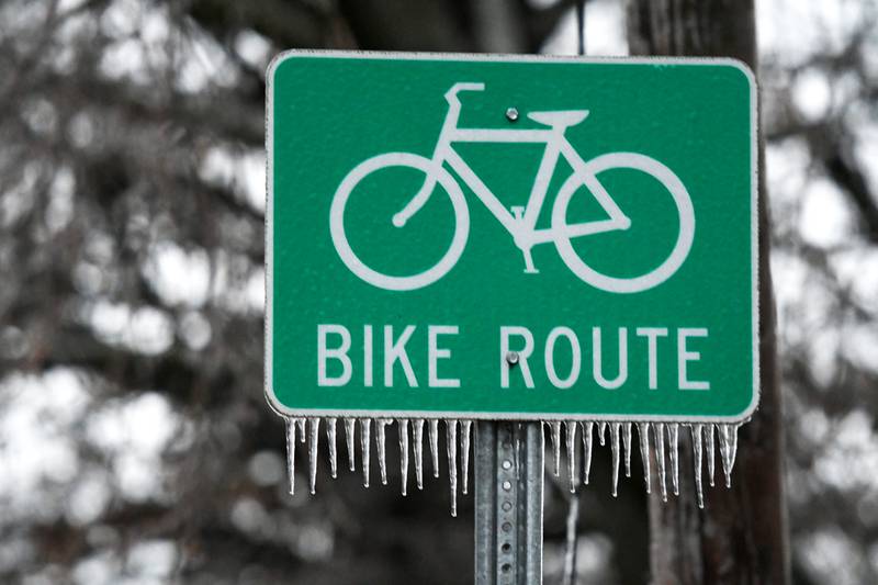 Icicles hang from a sign in Oregon late Wednesday afternoon as freezing rain fell across portions of Ogle County making travel hazardous for motorists and prompting cancellations of evening events.