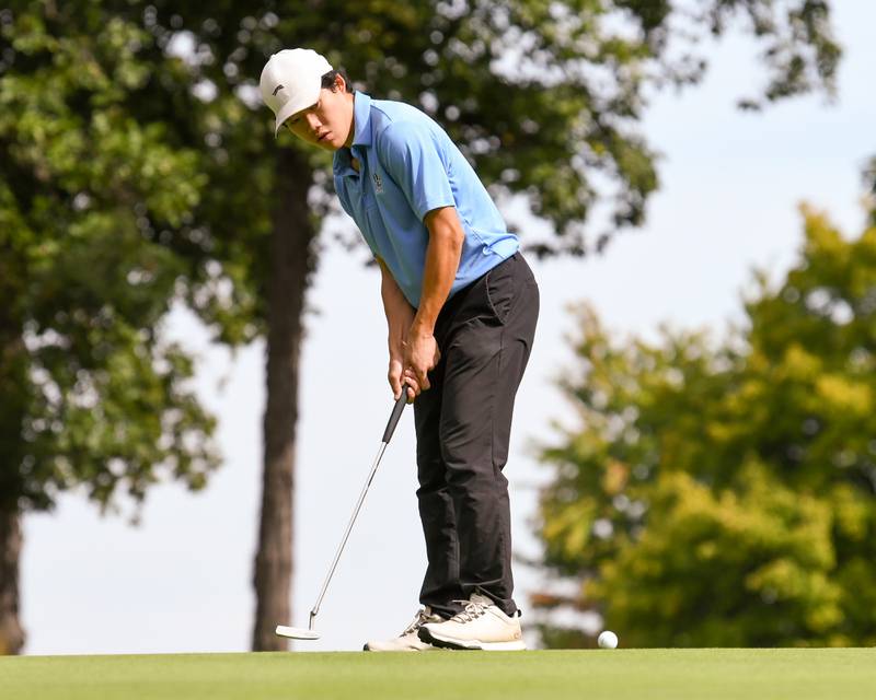 Logan Hong of Oswego East watches his putt during the Plainfield Central regional on Wednesday Oct. 1, 2025, held at Wedgewood Golf Course in Plainfield.