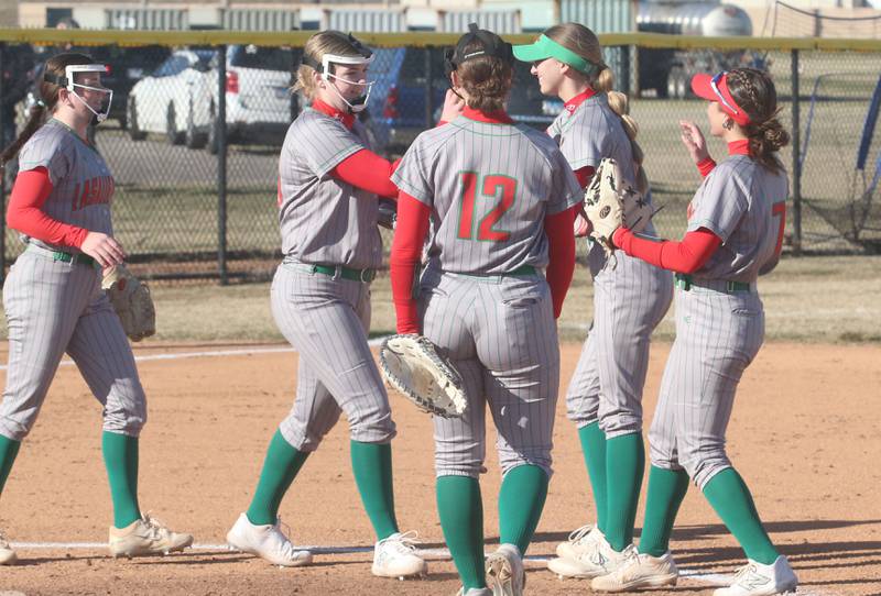 L-P softball players hi-five each other on the mound while playing Princeton on Tuesday, March 25, 2025 at the L-P Athletic Complex in La Salle.