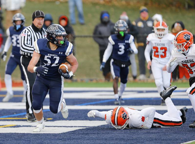 IC Catholic's Jesse Smith (52) intercepts the ball in the endzone during the Class 3A varsity football semi-final playoff game between Byron High School and IC Catholic Prep on Saturday, Nov. 19, 2022 in Elmhurst, IL.