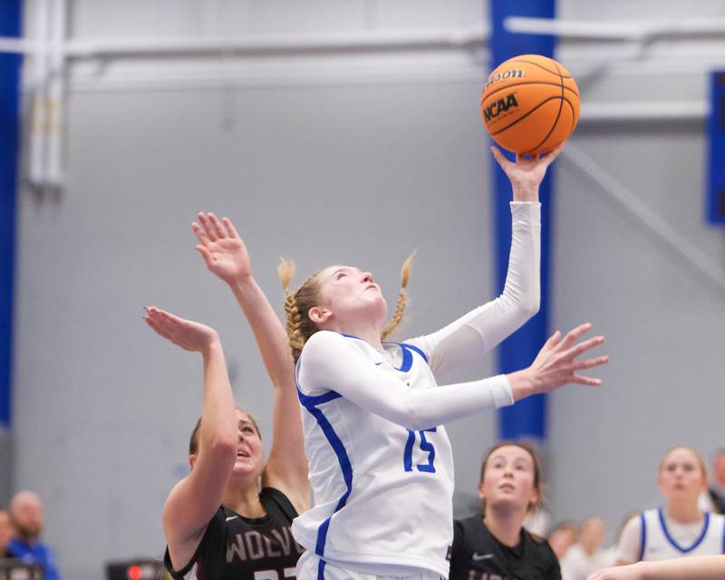 St. Charles North's Bronwyn How goes in for the shot against Prairie Ridge at the Burlington Central Tournament on Tuesday, Nov. 19,2024 in Burlington.
