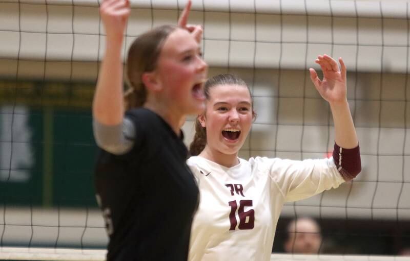 Prairie Ridge’s Allison Rogers, left, and Adeline Grider celebrate a point against Woodstock North in IHSA Class 3A Sectional semifinal volleyball action on Tuesday, Nov. 5, 2024, at  Crystal Lake South High School  in Crystal Lake.