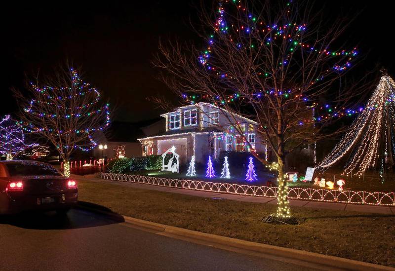 Kris and Kristen Koppers of Channahon create an elaborate holiday display and light show at their home each year. The goal is to brighten the holidays for the community as well as cancer patients.