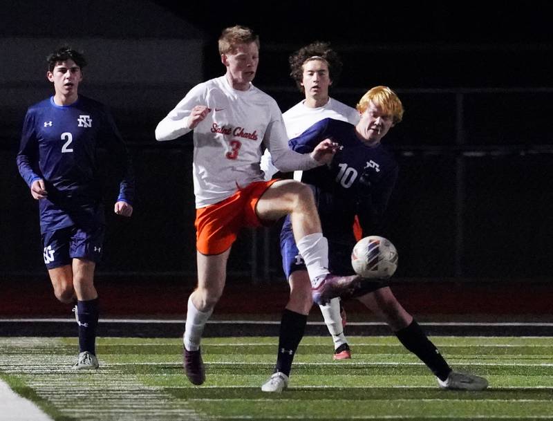St. Charles East's Marc Walker (3) plays the ball against New Trier's Aidan O'Neill (10) during the class 3A St. Charles North Boys Soccer Supersectional match at St. Charles North High School on Wednesday, Nov. 1, 2023.