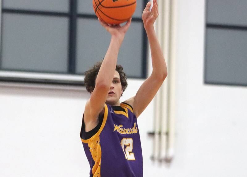 Wauconda’s Austin Carlsen drains a three-pointer  in varsity basketball Friday, Dec. 20, 2024 at Dundee-Crown High School in Carpentersville.