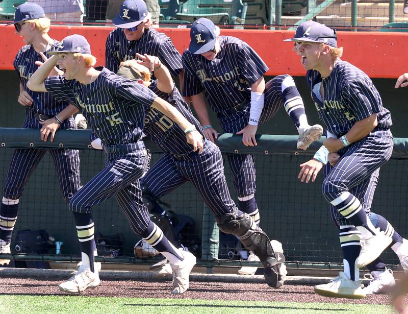 Lemont players rush the field after the last out of their Class 3A state semifinal win over Highland Friday, June 7, 2024, at Duly Health and Care Field in Joliet.