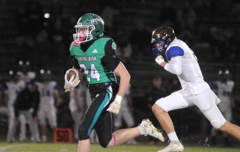 Seneca's Brody Rademacher (24) sprints away from DuPec's Jordan Gassman for a 72-yard touchdown early in the game Friday, Oct. 24, 2024, in Seneca.