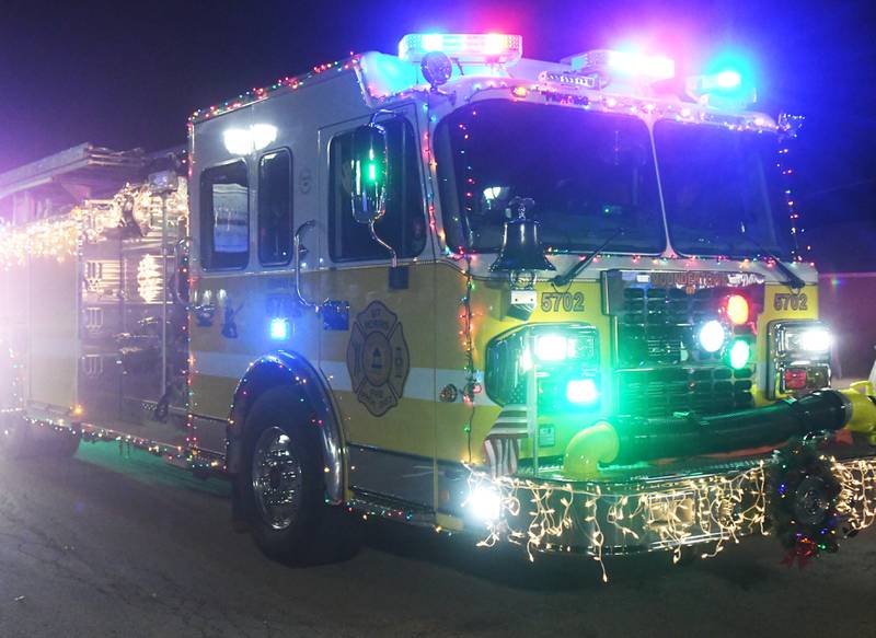 Mt. Morris Fire vehicles, decorated for Christmas, led the way at the lighted parade that kicked off Mt. Morris' Festival of Lights on Dec.3.