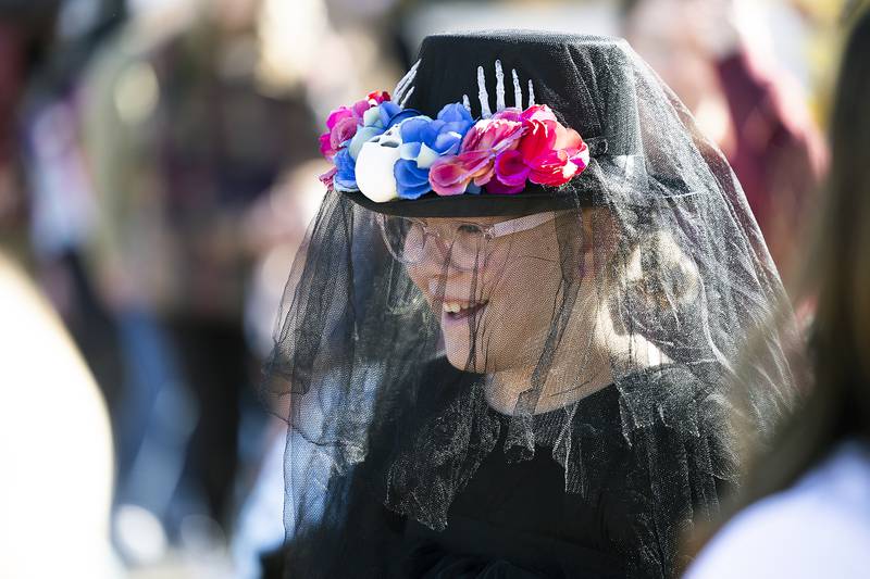 Arhabella Leif, 10, of Rock Falls smiles under her black veil Saturday, Oct. 26, 2024, in Dixon.