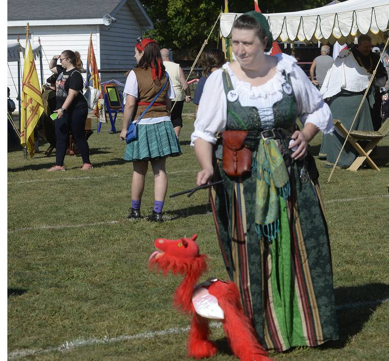 Charlene Weldon  the “Mother Of All Dragons” . walks one of her creations throughout Guthrie Ball Park Saturday during the annual Marseilles Renaissance Faire. Crafts , demonstrations also were part of the event. 09/10/22 Tom Sistak Photo