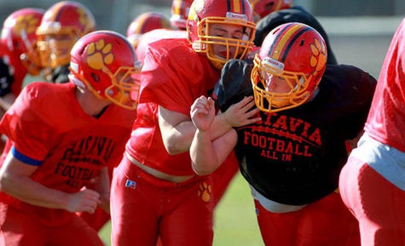 Batavia defensive tackle Ryan Minniti (far right) practices with his team Tuesday afternoon.